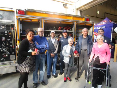 Staff and residents from Lantern Crest visit with Firefighters Patrick and Josh